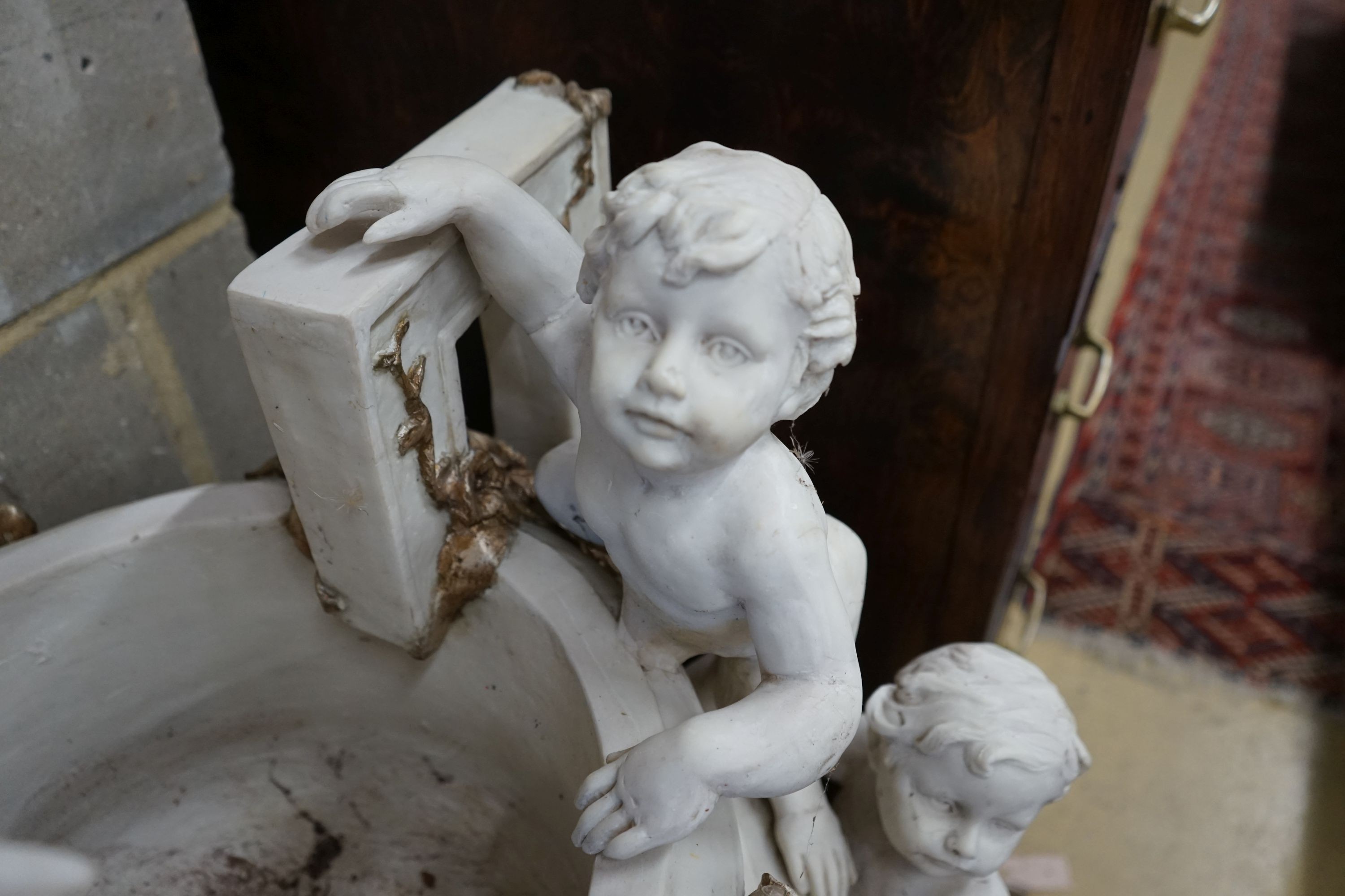 A pair of composition faux marble cherub and mask jardinieres, height 112cm